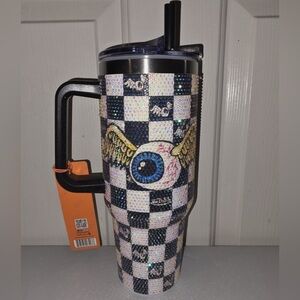 Checkered Tumbler with Eye and Wing Design